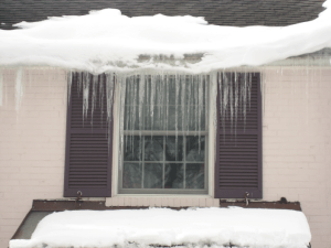 Icicles on White Brick House
